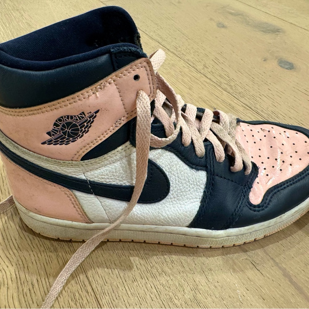 women’s size 7 air Jordan mid sneakers. Worn but still excellent condition
